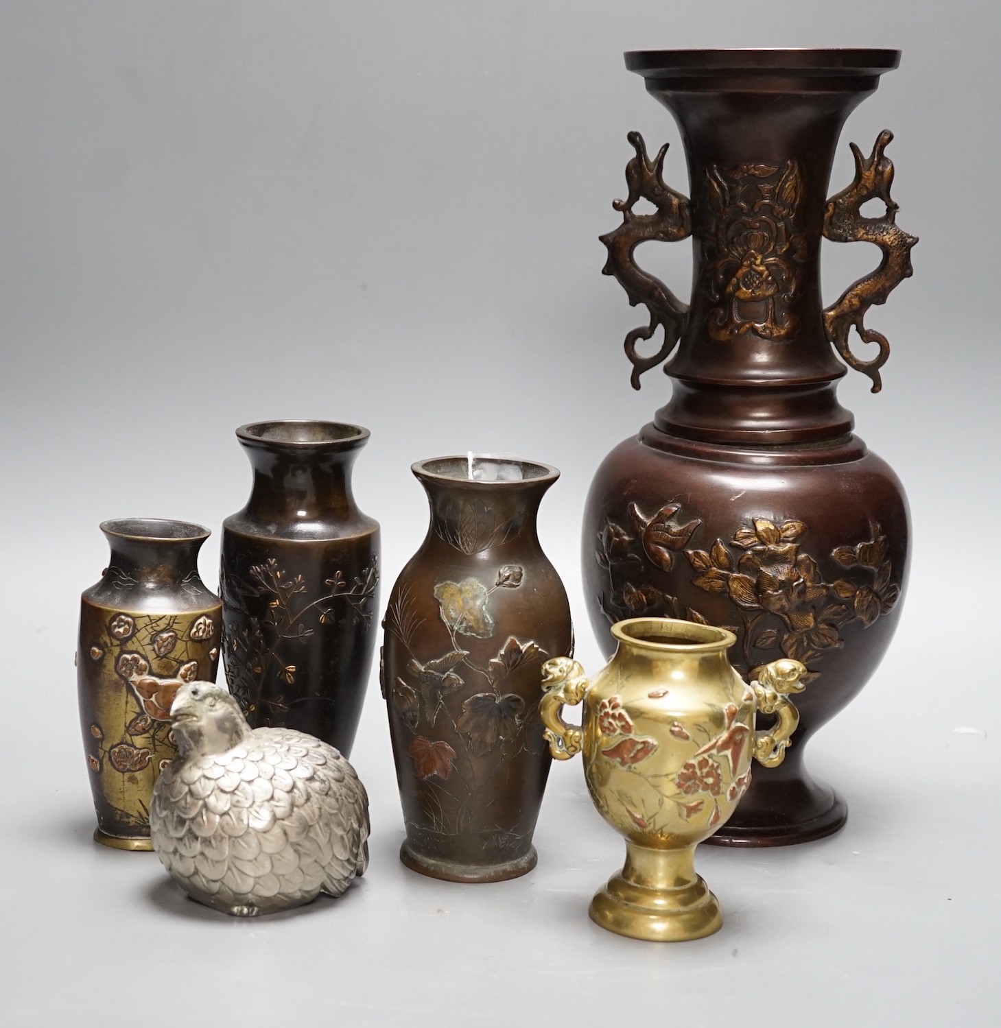 A group of Japanese bronze and mixed metal vases and a plated sugar castor, tallest 30cm